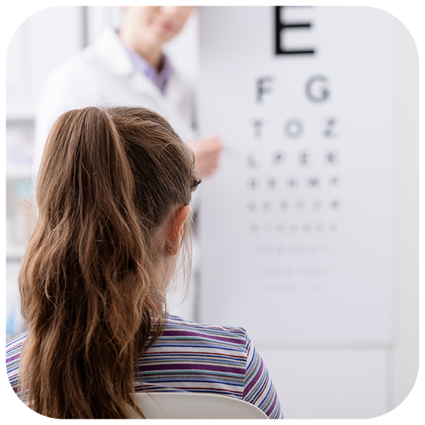 Woman doing an eye exam